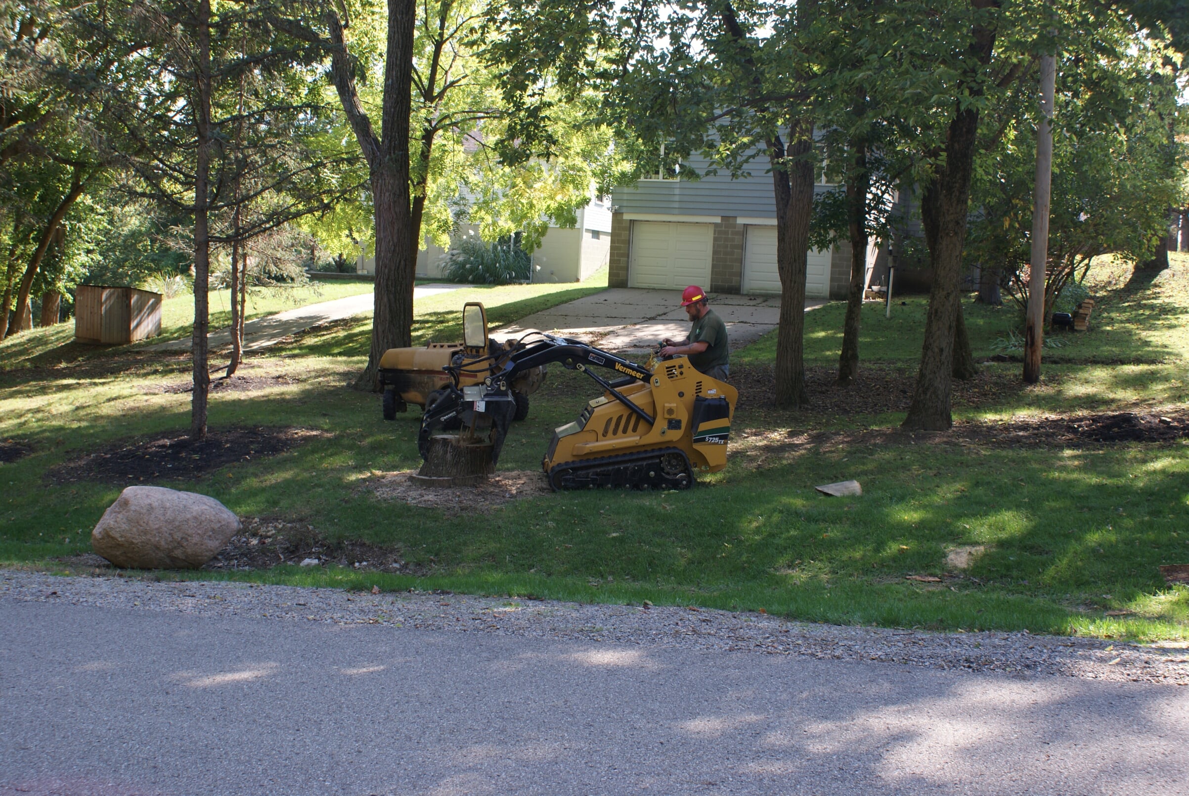 Mid Ohio Tree Service grinding a tree stump with a Vermeer stump grinder